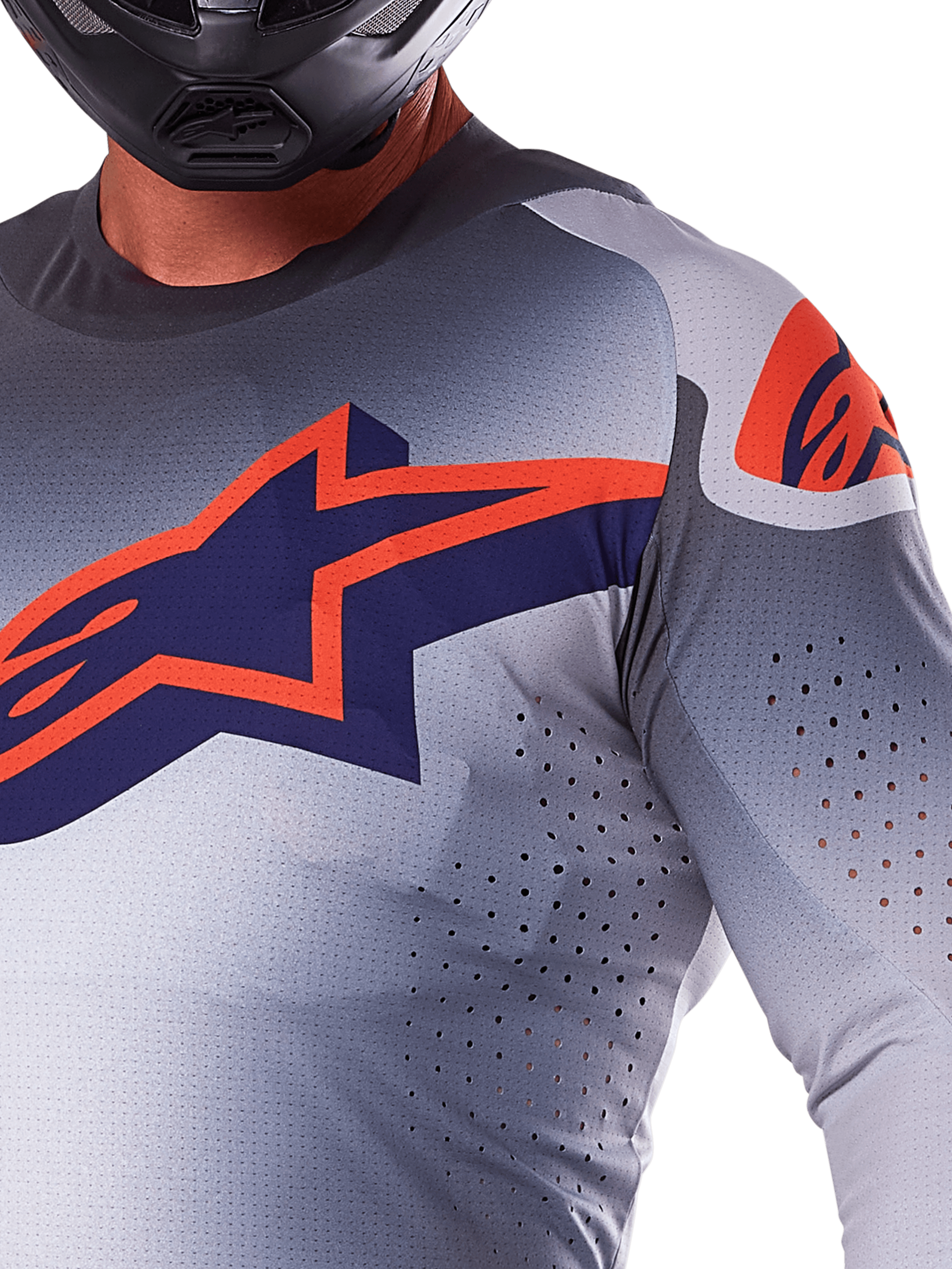 Alpinestars 2025 Supertech Lipan Jersey, Motocross Jersey, Gray Orange Fluo, featuring large navy and orange star logo on the chest, laser-cut perforations for airflow, lightweight mesh construction, worn with a black helmet