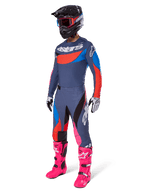 Alpinestars 2025 Techstar Dreem Motocross Gear Set, complete off-road racing outfit featuring a gray and blue jersey with red accents, matching pants with pink highlights, black helmet, bright pink boots, and white and black gloves