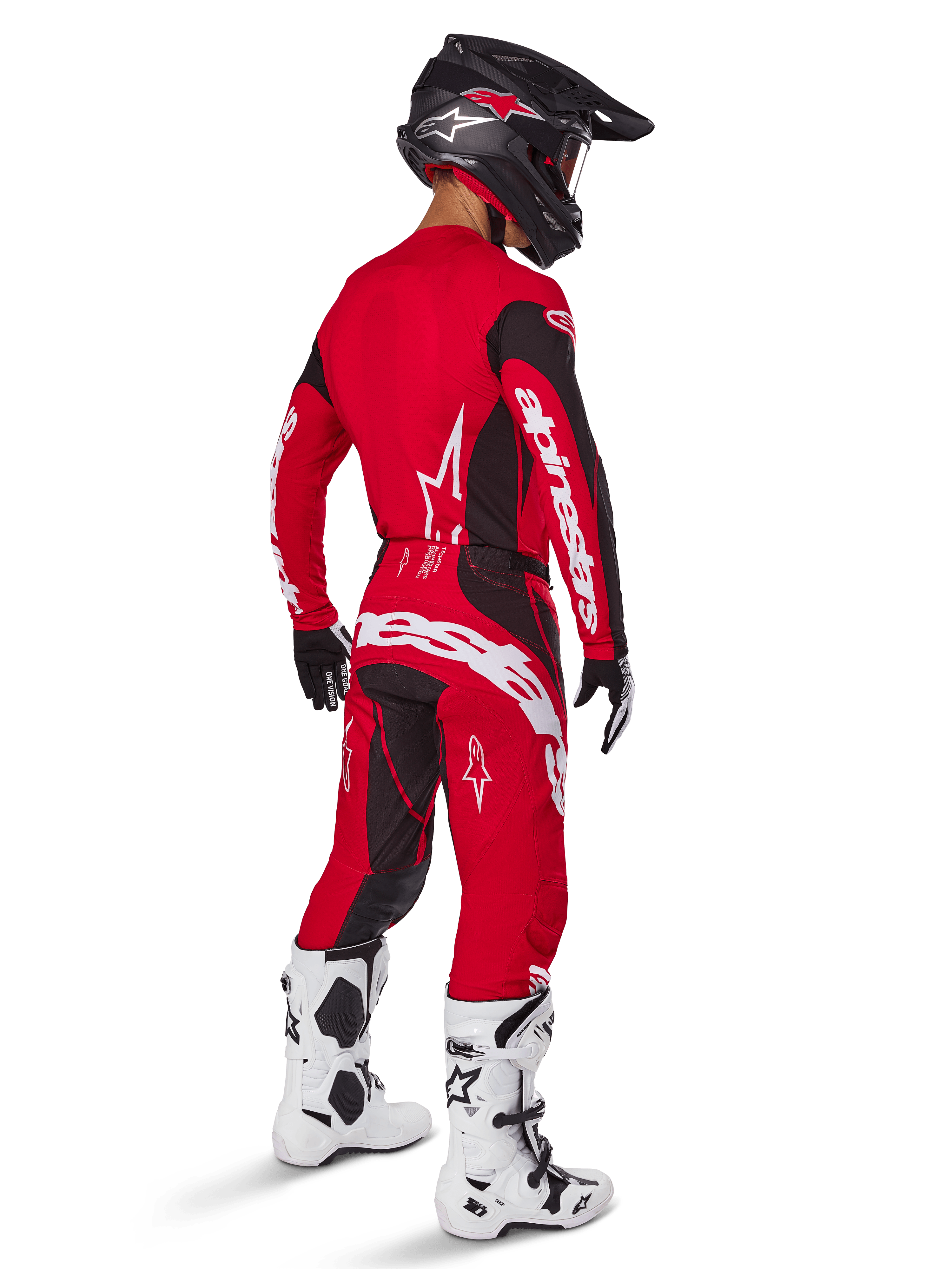 Motocross rider wearing the Alpinestars 2025 Techstar Dreem Gear Set in Bright Red and Black, featuring white branding on the jersey and pants, paired with a black helmet, white and black boots, and black and white gloves, rear three-quarter view.