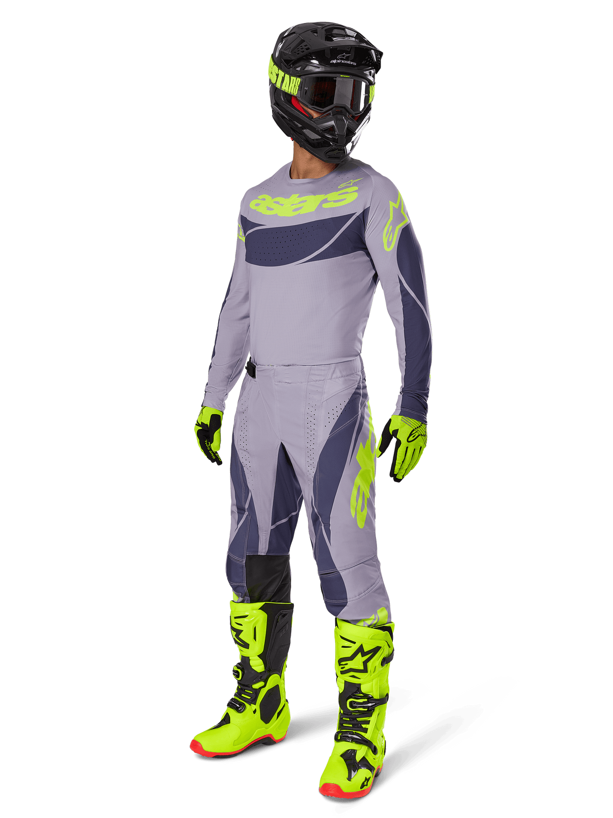Alpinestars 2025 Techstar Dreem Gear Set, Motocross-Fahrer in kompletter Rennausrüstung, graues Jersey und Hose mit dunkelgrauen Mustern und neongelb-grünen Akzenten, passender schwarzer Helm, neongelb-grüne Handschuhe und Stiefel, Performance-Offroad-Ausrüstung