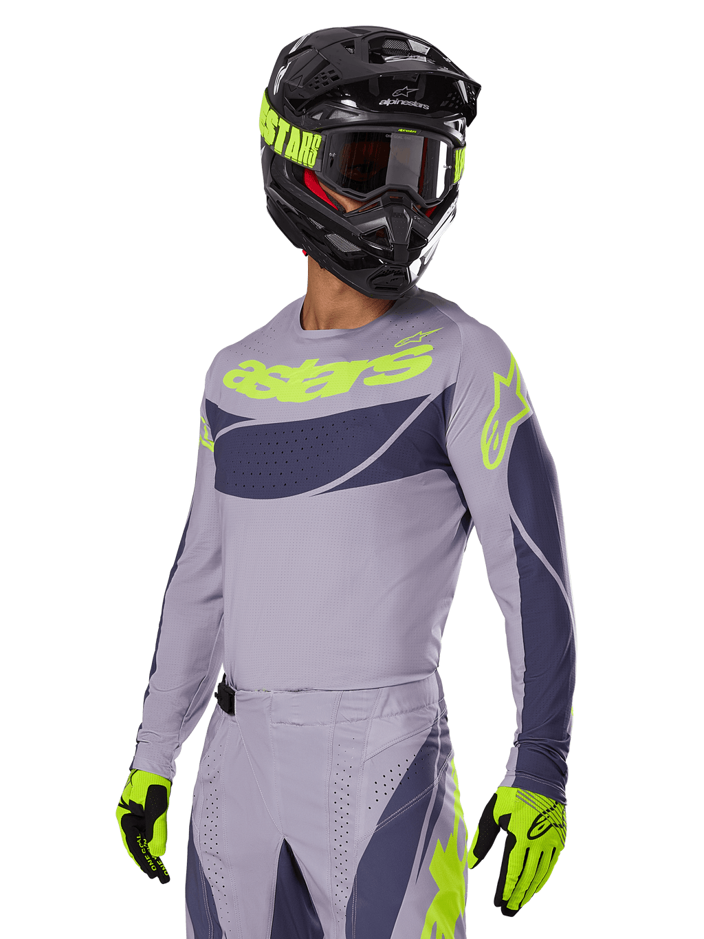 Motocross rider wearing Alpinestars 2025 Techstar Dreem Jersey, Gray and Dark Gray with lime green logos, matching pants, black helmet with lime green accents, lime green and black gloves, coordinated outfit for off-road racing