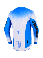 Alpinestars 2026 Supertech Scenz Trikot, Rückansicht, Ucla Blue und Weiß, professionelles Motocross-Trikot mit Mesh-Konstruktion und lasergeschnittenen Perforationen, markante schwarze Ärmelgrafiken und technisches Branding auf der Rückseite.