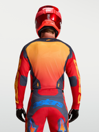 Alpinestars Racer Hunt Jersey, men's motocross racing gear in Fire Red and Graystone with yellow and blue accents, rear view on model.