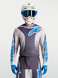 Alpinestars Fluid Drag Trikot, Herren-Motocross-Ausrüstung in Grau und Blau, leichte atmungsaktive Konstruktion.