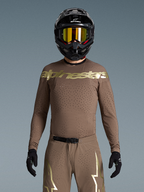 Alpinestars Limited Edition Supertech Air Gold Trikot, braun-goldenes Motocross-Trikot mit lasergeschnittener Belüftung.