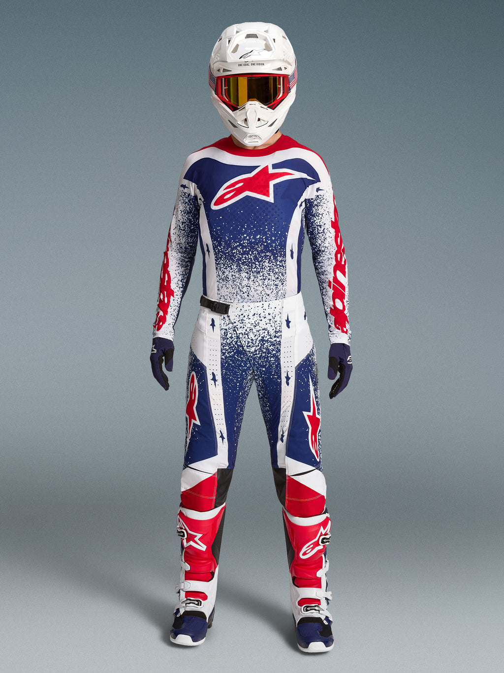 Alpinestars Techstar Unity Bekleidungsset Limited Edition, Motocross-Rennoutfit für Herren, Weiß, Blau und Rot mit Grafiken.