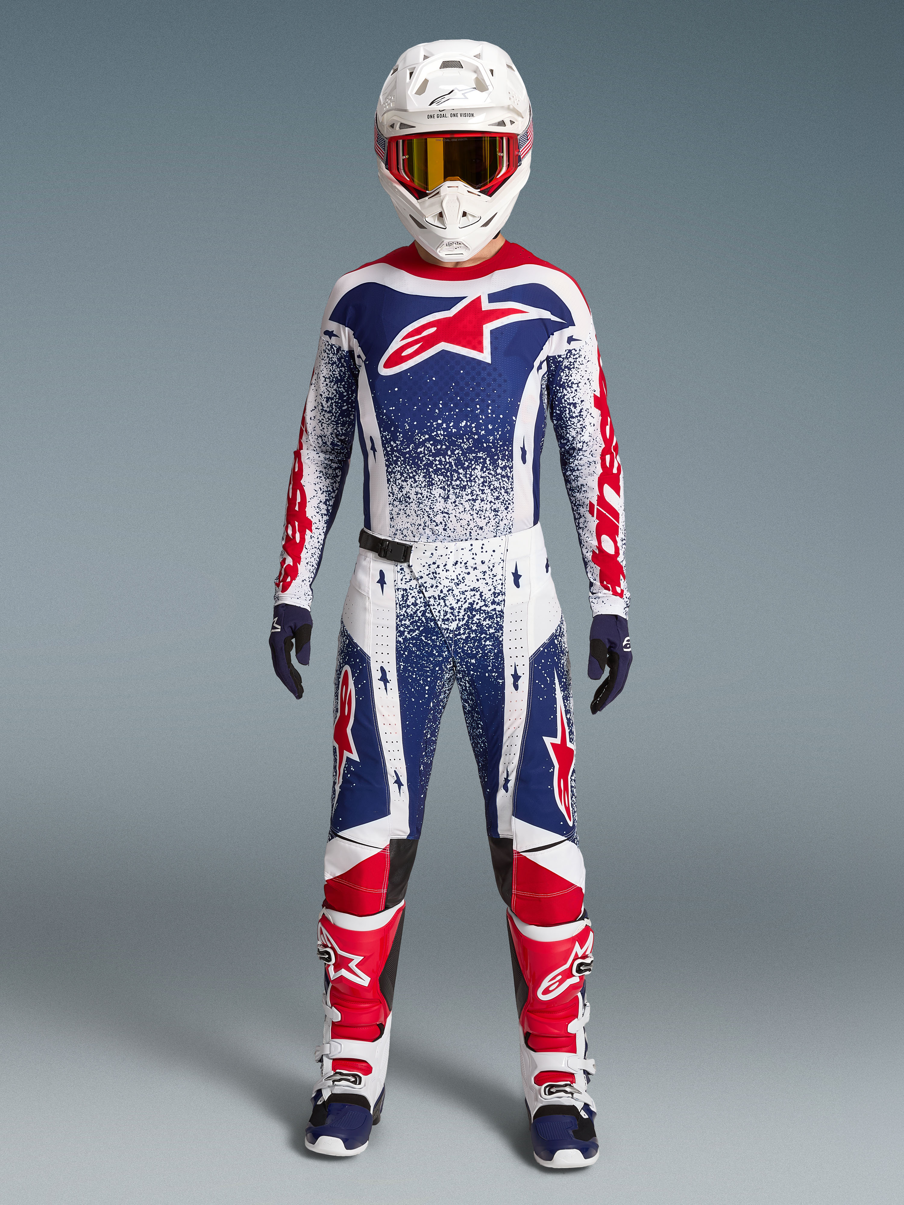 Alpinestars Techstar Unity Bekleidungsset Limited Edition, Motocross-Rennoutfit für Herren, Weiß, Blau und Rot mit Grafiken.