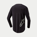 Alpinestars 2024 Fluid Graphite Jersey, Motocross-Jersey, Schwarz und Silber, Rückansicht mit silbernem Stern-Logo auf der unteren Seite, langärmliges Design mit verlängerter Rückenpartie für Abdeckung beim Offroad-Fahren.