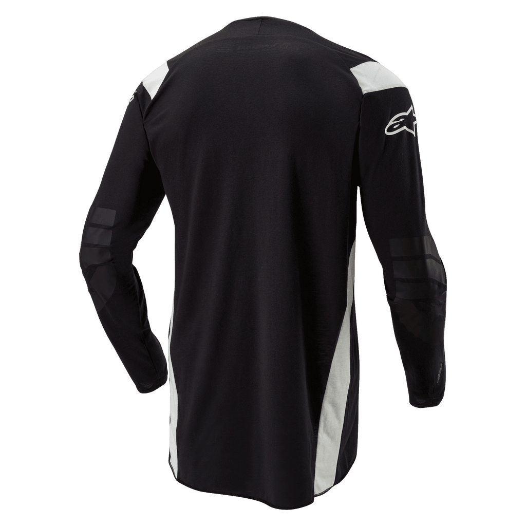 Alpinestars Techdura Jersey, Enduro-Motocross-Trikot, Schwarz mit weißen Akzenten, Rückansicht mit verlängertem Rückenteil, verstärkte Ellbogen und weißes Alpinestars-Logo auf dem Ärmel, strapazierfähige Offroad-Bekleidung