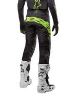 Alpinestars 2024 Techstar Rantera Hose, Motocross-Hose, Schwarz, Navy und Gelb Fluo, Rückansicht, mit auffälligem neongelbem Branding und Mesh-Belüftungseinsätzen, getragen mit passendem Jersey und weißen Stiefeln, strapazierfähige Ausrüstung für Motocross und Offroad-Rennsport