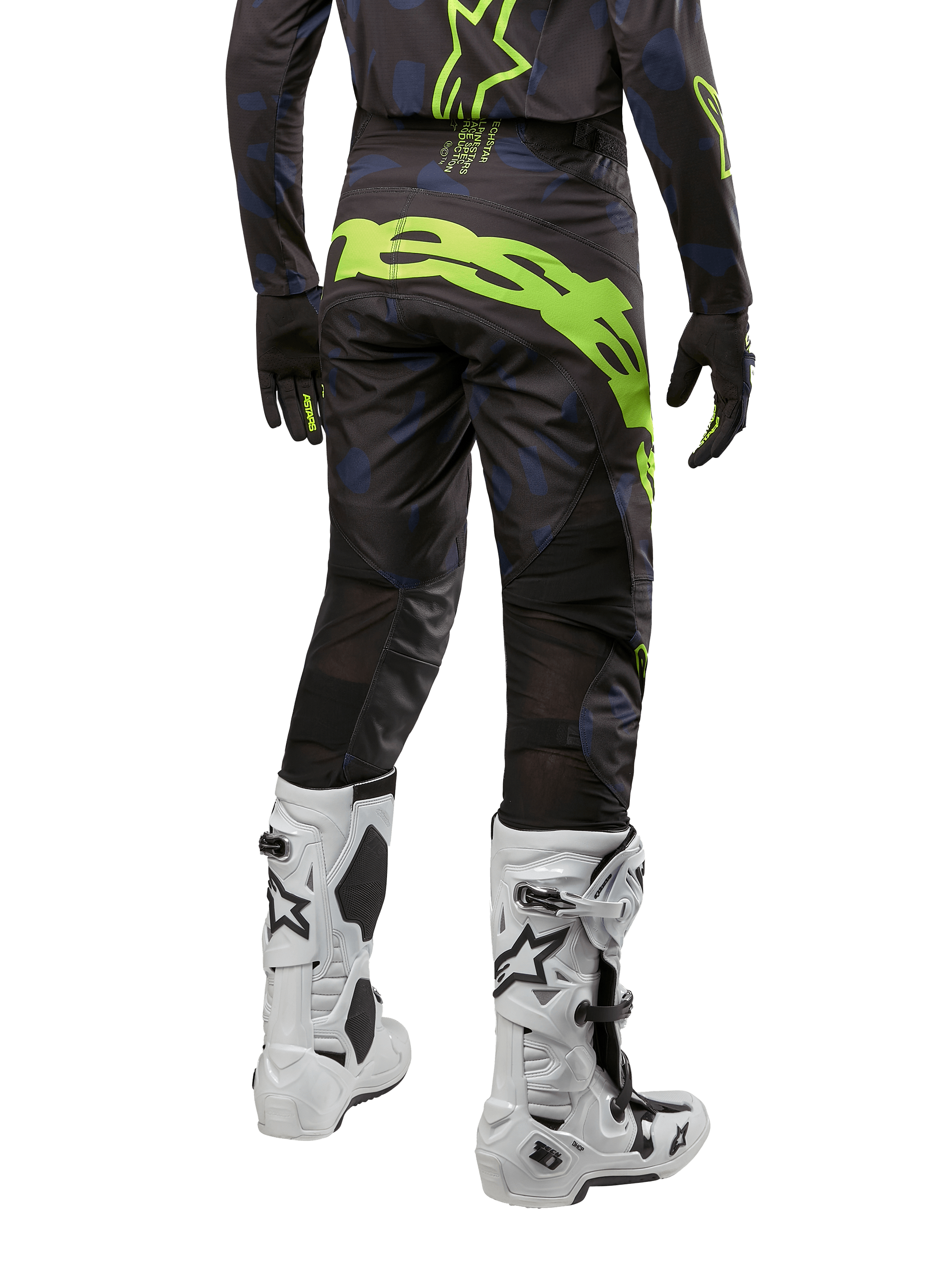 Alpinestars 2024 Techstar Rantera Hose, Motocross-Hose, Schwarz, Navy und Gelb Fluo, Rückansicht, mit auffälligem neongelbem Branding und Mesh-Belüftungseinsätzen, getragen mit passendem Jersey und weißen Stiefeln, strapazierfähige Ausrüstung für Motocross und Offroad-Rennsport