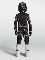 Alpinestars Fluid Apex V2 Jugend-Trikot und Gear Set, Motocross-Kombi in Schwarz und Silber, weiße Stiefel, Rückansicht.