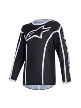 Alpinestars 2026 Youth Fluid Apex Trikot, Motocross-Trikot, Schwarz und Grau, mit einem großen weißen A-Star-Logo auf der Brust, weißen Paspel-Akzenten und einem Sportkragen, langärmelige Performance-Ausrüstung für Jugend-Offroad-Fahrten