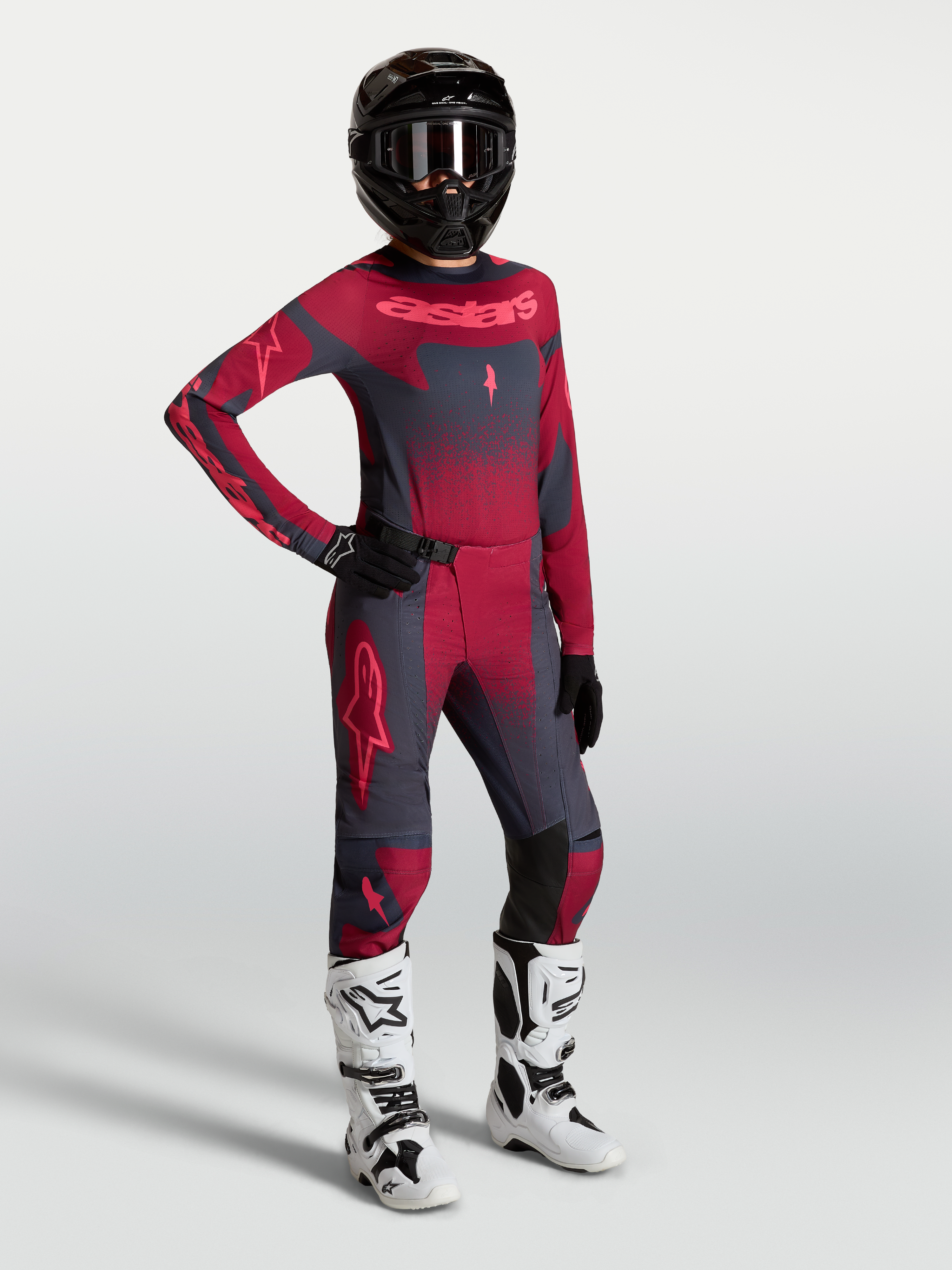 Alpinestars Stella Techstar Swan Pants and jersey, women's motocross outfit in crimson and dark gray with white racing boots.