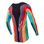 Alpinestars Stella 2024 Techstar Damen-Trikot, Motocross-Trikot, Schwarz Mehrfarbig, Rückansicht mit einem lebhaften wellenförmigen Mehrfarbenmuster in Rot, Gelb und Türkis, weißes Astar-Logo auf dem unteren Rücken, Alpinestars-Branding auf den Ärmeln.