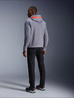 Alpinestars Chrome V2 Sport Hoodie in Gray Heather, back view showing a large Red Fluo Alpinestars wordmark across the hood, worn by a model with black pants and dark riding shoes, casual urban motorcycle apparel