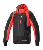 Alpinestars MO.ST.EQ Hybrid Hooded Jacket, Black and Flame Red, technical motorcycle hoodie with angled front zipper, red chest pocket, embossed pattern on torso, and thumb loops, blending urban streetwear with protective riding gear