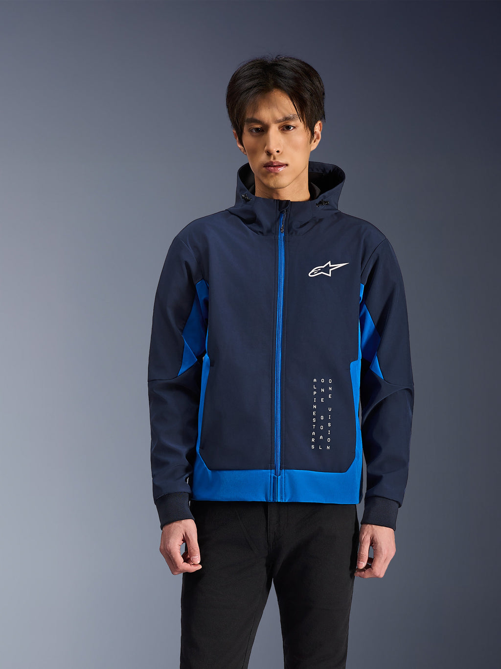 Alpinestars Radium Tech Hoodie, Urban Motorcycle Jacket, Night Navy and Royal Blue, featuring front zipper, white chest logo, and vertical branding, technical shell construction with an athletic fit
