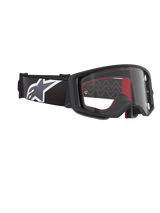 Alpinestars Supertech Corp Goggles, Motocross Goggles, Black Grey Clear, featuring a clear polycarbonate lens, wide black strap with a grey and white Astars logo, 3D molded face foam, high-performance protective eyewear for off-road racing