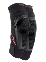 Alpinestars Bionic Flex Knee Protectors, Black and Red, pair of motocross knee guards featuring perforated Nucleon Flex Technology shields, red Astars logos, and elasticated straps on a breathable black mesh sleeve.