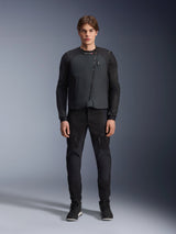 Male model wearing the Alpinestars Tech-Air® 3 V2 System, black autonomous motorcycle airbag vest, front view, paired with black mesh riding pants and black sneakers, showcasing a lightweight and integrated safety outfit for road riding.