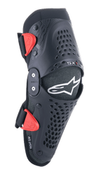 Alpinestars Youth SX-1 Knee Protectors, Motocross Knee Guards, Black and Red, featuring perforated ventilation holes, dual-pivot hinge system, adjustable straps with red buckles, white star logo, youth off-road motorcycle protection