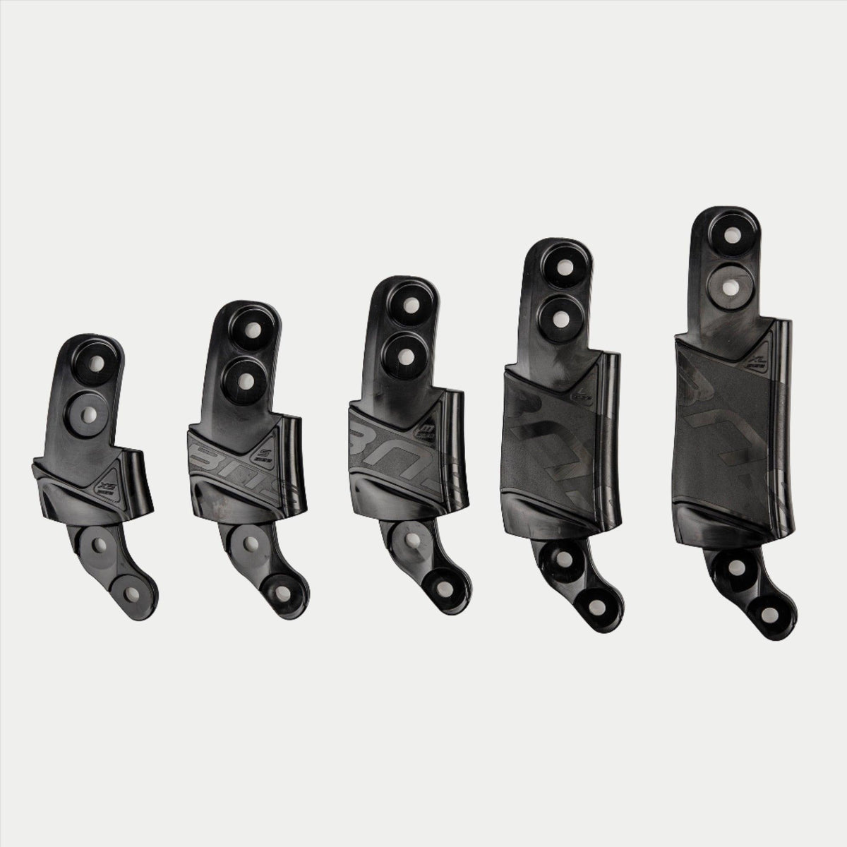 Alpinestars BNS Size Adapter Kit, Helmet and Neck Support Accessory, Five black plastic adapter components in graduated sizes, modular design for fit adjustment with mounting holes and textured branding, solid black color