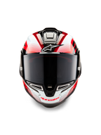 Alpinestars Supertech R10 Team Helm, Vorderansicht, Schwarz-Carbon, Rot und Weiß glänzend, mit dunkel getöntem Visier, weißes Astar-Logo auf der Stirn, rotes Alpinestars-Branding am Kinnbügel, aerodynamisches, renntaugliches Design mit aufwendigen Grafiken