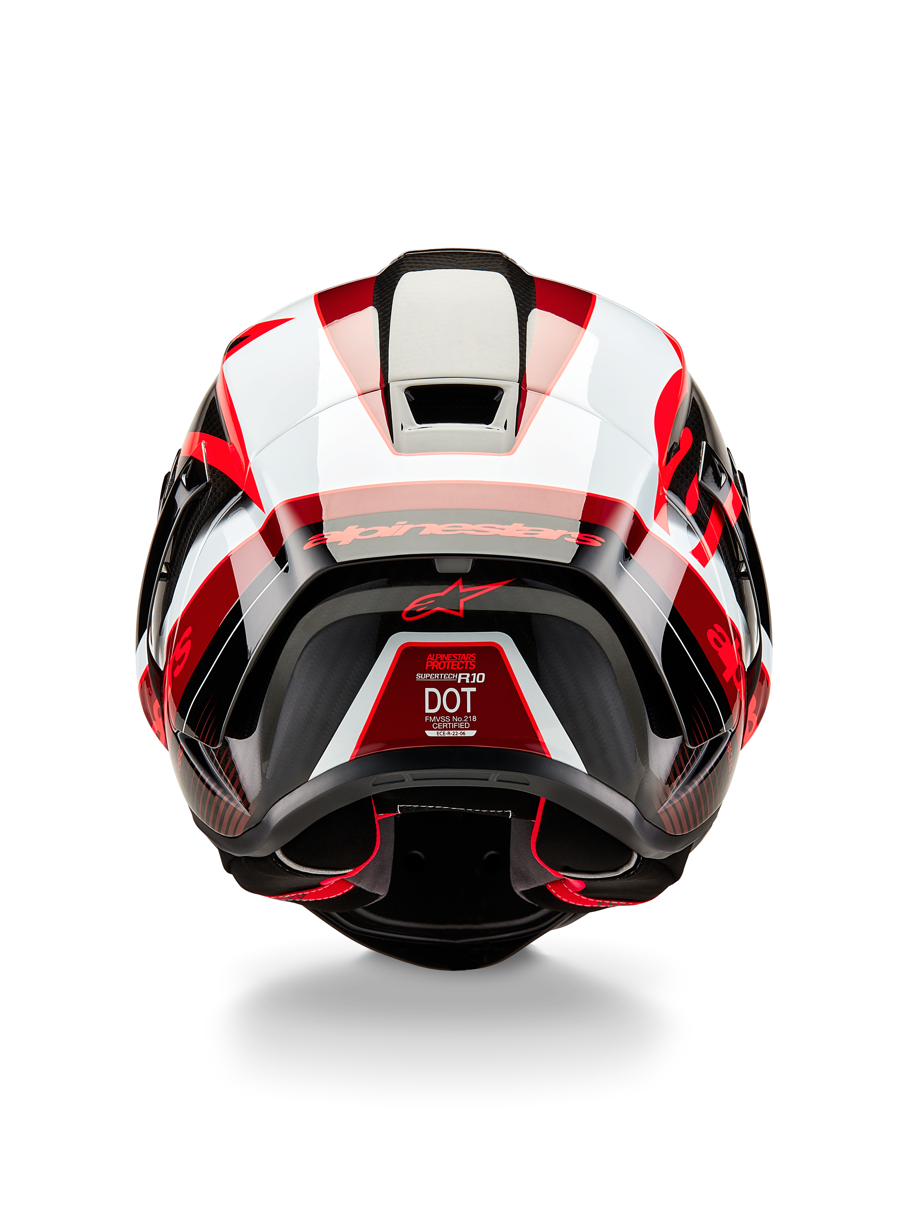 Alpinestars Supertech R10 Team Helm, Rückansicht, Schwarz Carbon Rot und Weiß glänzend, aerodynamisches Schalendesign mit markanten roten und weißen Paneelen, Alpinestars-Branding auf dem Spoiler und ein rotes Stern-Logo, professioneller Rennmotorradhelm