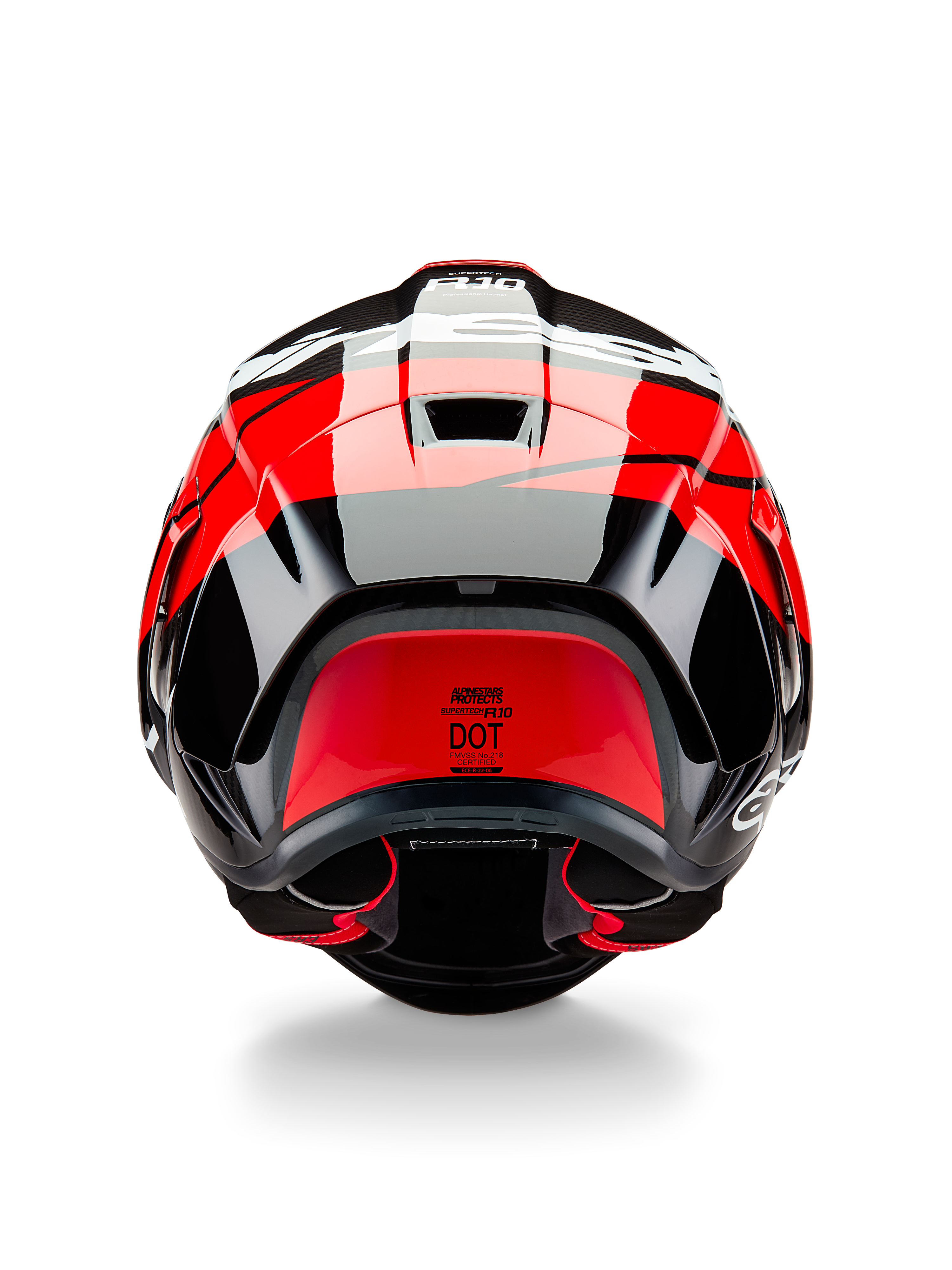 Alpinestars Supertech R10 Element Helm, Rückansicht, Schwarz-Carbon mit leuchtend roten und weißen glänzenden Akzenten, mit aerodynamischem Heckspoiler, Entlüftungsöffnungen und DOT-Zertifizierungslabel, elegantes, vom Rennsport inspiriertes Design mit Carbonfaser-Details