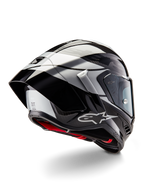 Alpinestars Supertech R10 Element Helmet, Black Carbon Silver Black Glossy, rear three-quarter view showing aerodynamic racing profile, glossy carbon fiber shell with geometric grey and black graphics, Alpinestars logo, and red interior padding