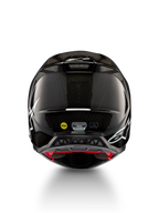 Alpinestars Supertech M10 Solid Helm ECE 22.06, schwarzer glänzender Carbon-Motocross-Helm mit weißen Grafiken, Rückansicht mit Belüftungsöffnungen sowie sichtbaren MIPS- und ECE-R-22.06-Kennzeichnungen