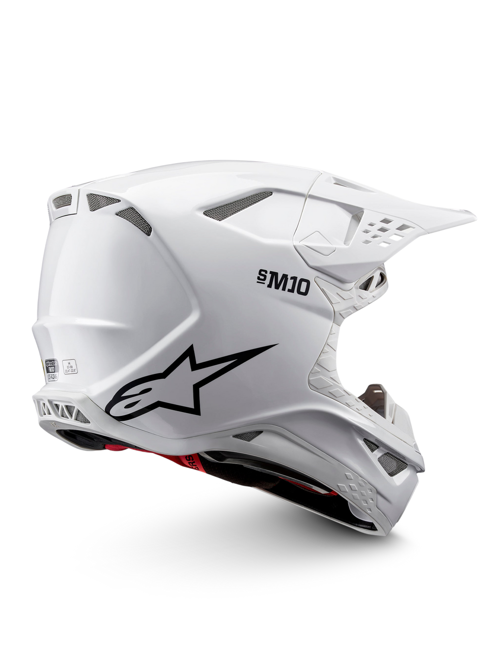 Alpinestars Supertech M10 Solid Helmet ECE 22.06, white glossy motocross helmet with black graphics, red accents, ventilation ports and peak visor