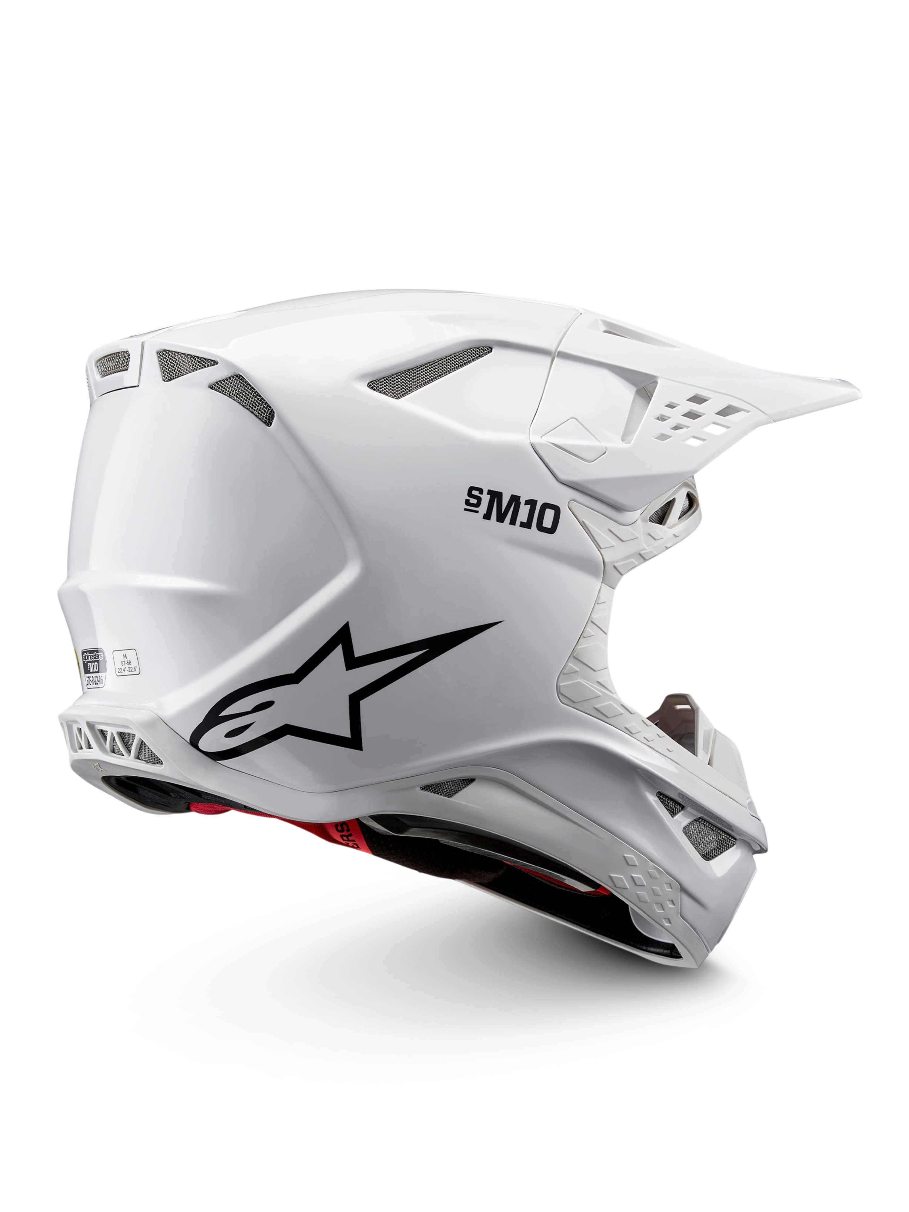 Alpinestars Supertech M10 Solid Helmet ECE 22.06, white glossy motocross helmet with black graphics, red accents, ventilation ports and peak visor