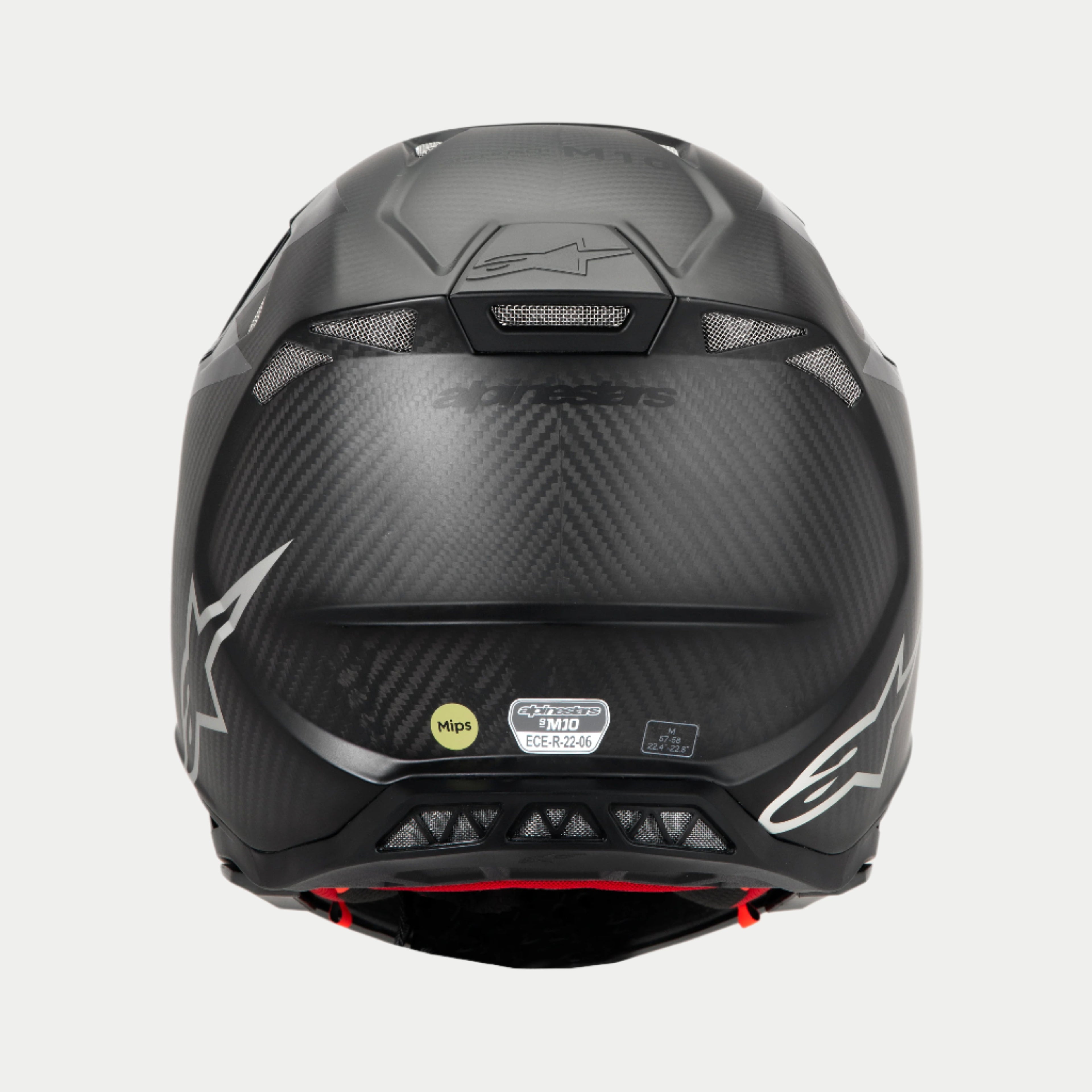 Alpinestars Supertech M10 Fame ECE 22.06 Helm, Rückansicht, Carbon Schwarz matt und glänzend, sichtbares Carbonfasergewebe, Belüftungsöffnungen mit Mesh-Gewebe, MIPS- und ECE-Zertifizierungslabels, Alpinestars-Logo.