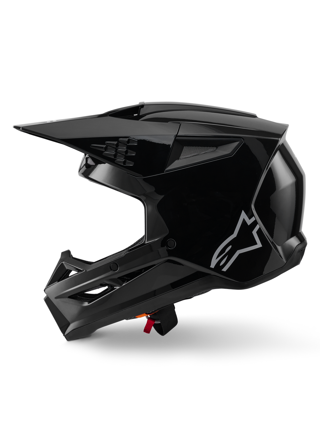 Alpinestars S-M3 Solid Helm, Motocross-Helm, Schwarz glänzend, Seitenansicht, mit silbernem Alpinestars-Logo, aerodynamischem Visier und mehreren Belüftungsöffnungen für den Offroad-Rennsport