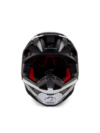 Alpinestars Supertech M10 Ampress Helm, Motocross-Helm, Schwarz und Weiß Matt, Vorderansicht mit rotem Innenfutter, aerodynamische Schale mit Belüftungsöffnungen und Alpinestars-Logo