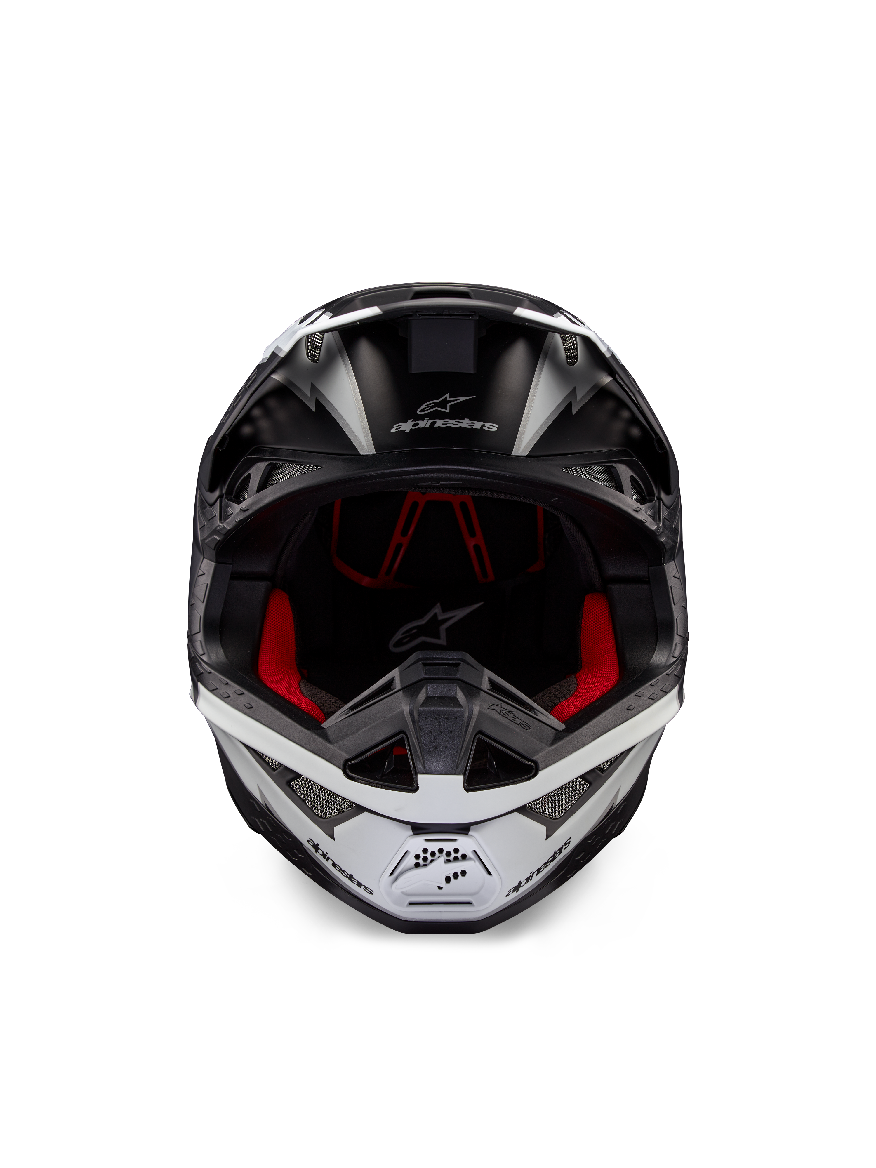 Alpinestars Supertech M10 Ampress Helm, Motocross-Helm, Schwarz und Weiß Matt, Vorderansicht mit rotem Innenfutter, aerodynamische Schale mit Belüftungsöffnungen und Alpinestars-Logo