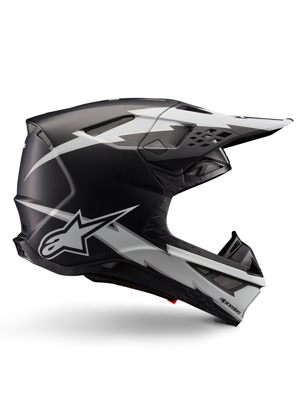 Alpinestars Supertech M10 Ampress Helm, Motocross-Rennhelm, Schwarz und Weiß Matt, aerodynamisches Profil mit weißen Blitz-Grafiken, mehrere Belüftungsöffnungen, verlängerter Sonnenschirm, Carbonfaser-Konstruktion mit mattem Finish