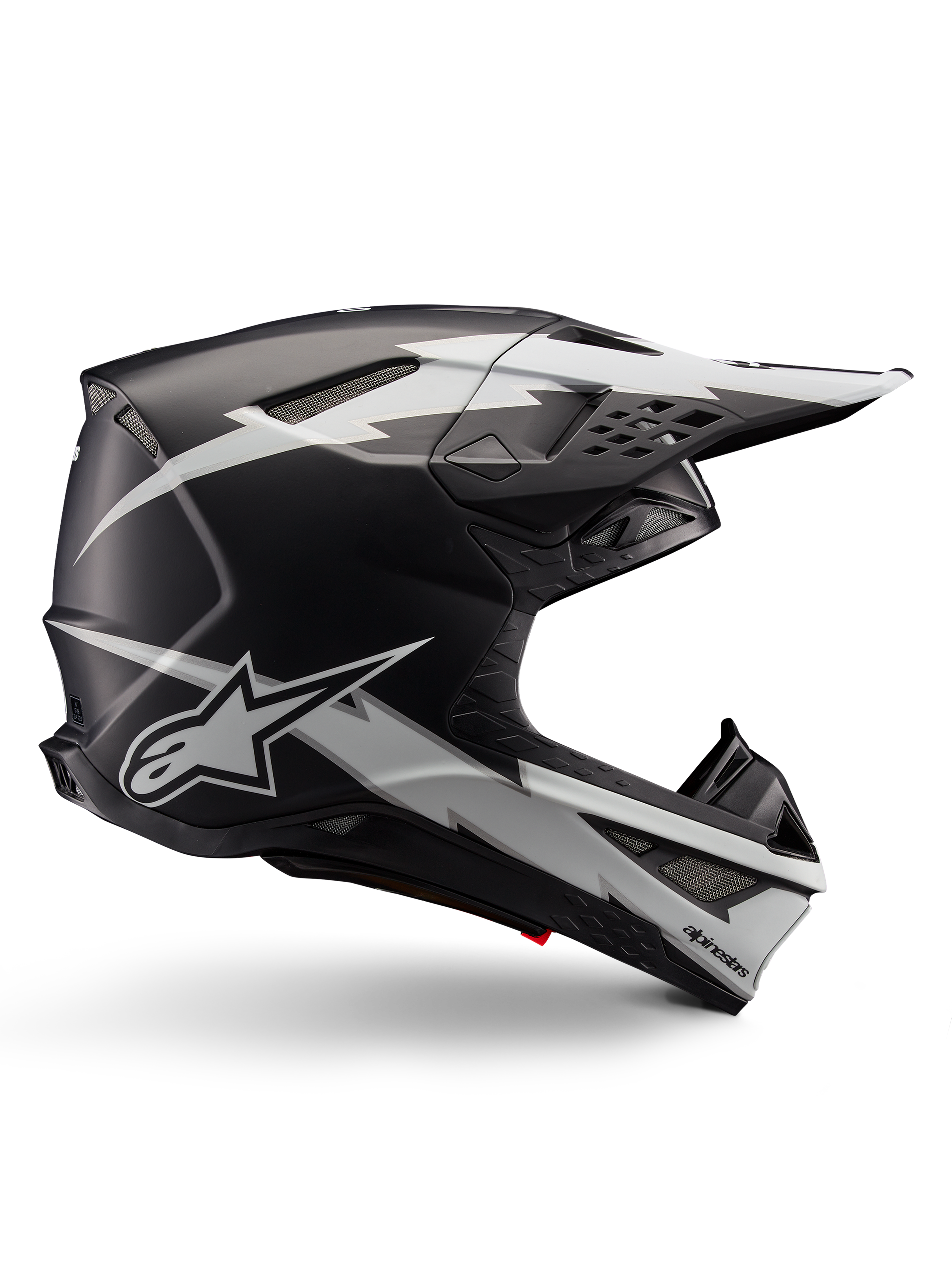 Alpinestars Supertech M10 Ampress Helm, Motocross-Rennhelm, Schwarz und Weiß Matt, aerodynamisches Profil mit weißen Blitz-Grafiken, mehrere Belüftungsöffnungen, verlängerter Sonnenschirm, Carbonfaser-Konstruktion mit mattem Finish