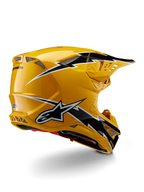Alpinestars Supertech M10 Ampress Helm, Motocross-Helm, Schwarz Gelb Glänzend, hochglänzendes gelbes Finish mit schwarz-weißen Grafiken im Blitz-Stil, Dreiviertelansicht von hinten mit aerodynamischer Schale und integrierten Belüftungsöffnungen.