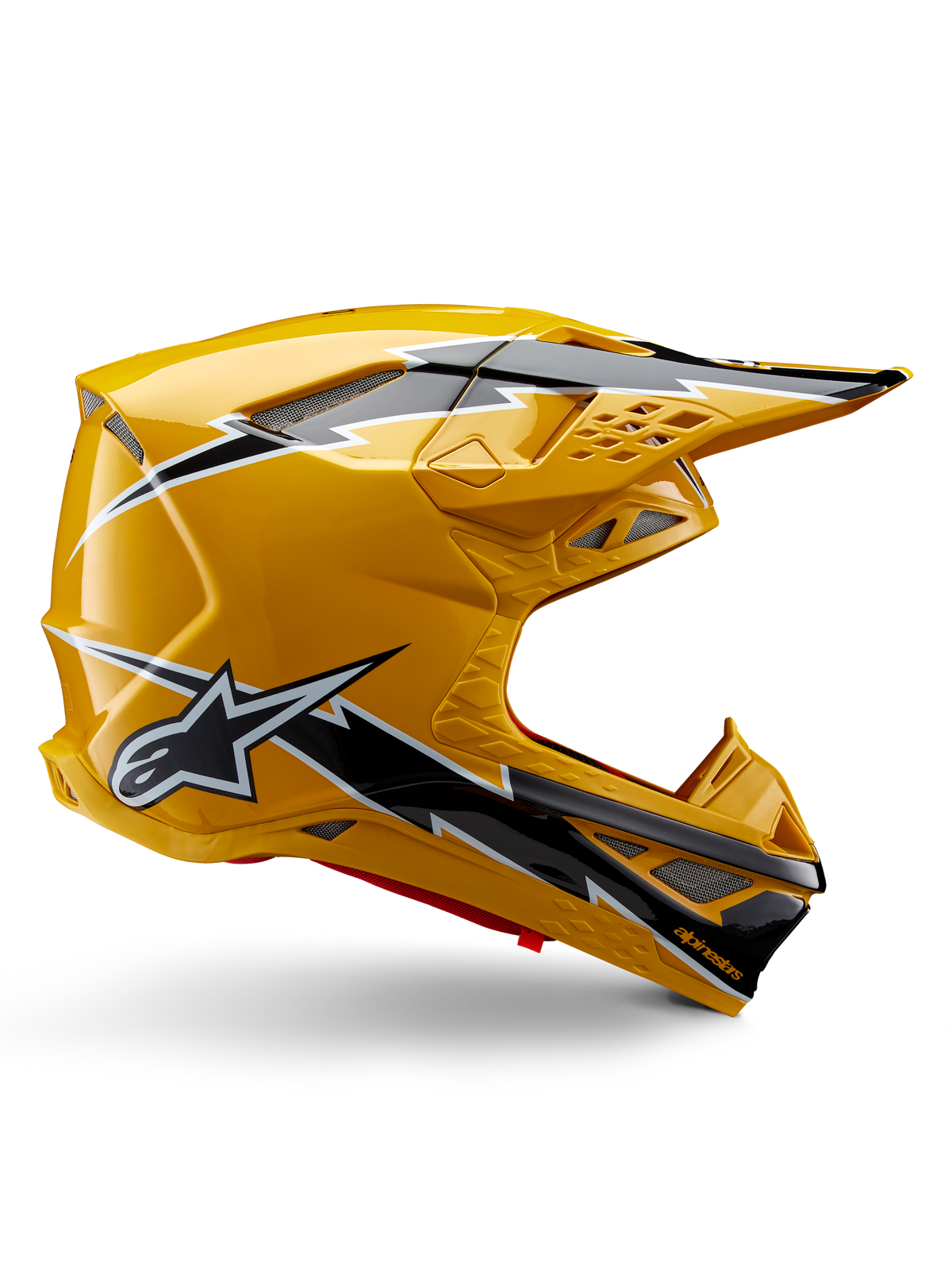 Alpinestars Supertech M10 Ampress Helm, Motocross-Helm, Schwarz und Gelb glänzend, Seitenprofil mit markanten schwarz-weißen Blitzgrafiken, Alpinestars Stern-Logo, aerodynamisches Design mit integrierten Belüftungsöffnungen und verstellbarem Visier.