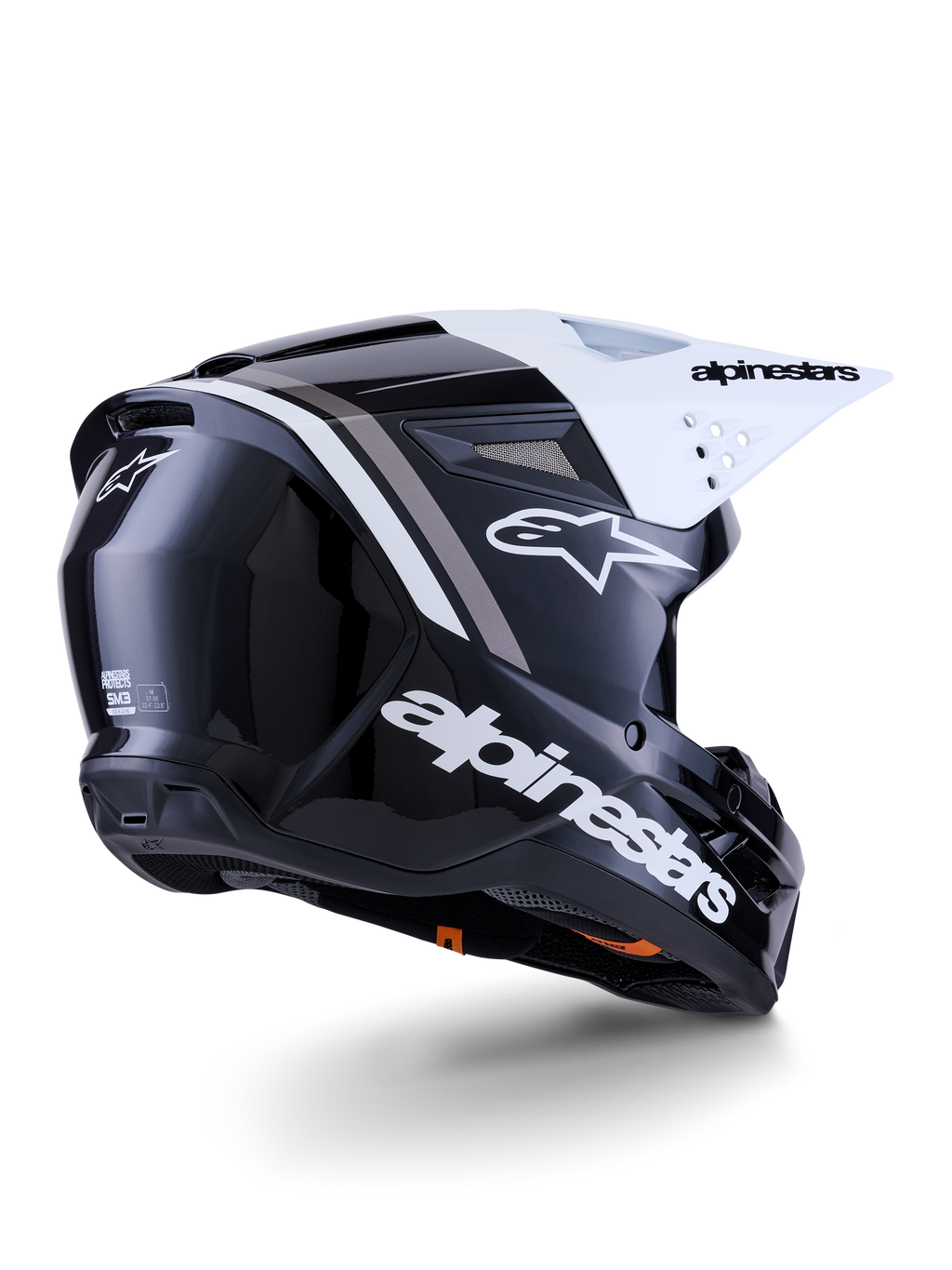 Alpinestars S-M3 Radium Helm, Motocross-Helm, Schwarz, Weiß und Grau glänzend, Rückseitenansicht mit weißem Visier, markantes Alpinestars-Logo an der Seite und hinten, aerodynamische Schale mit Belüftungsgittern, für Offroad-Motocross und Enduro konzipiert