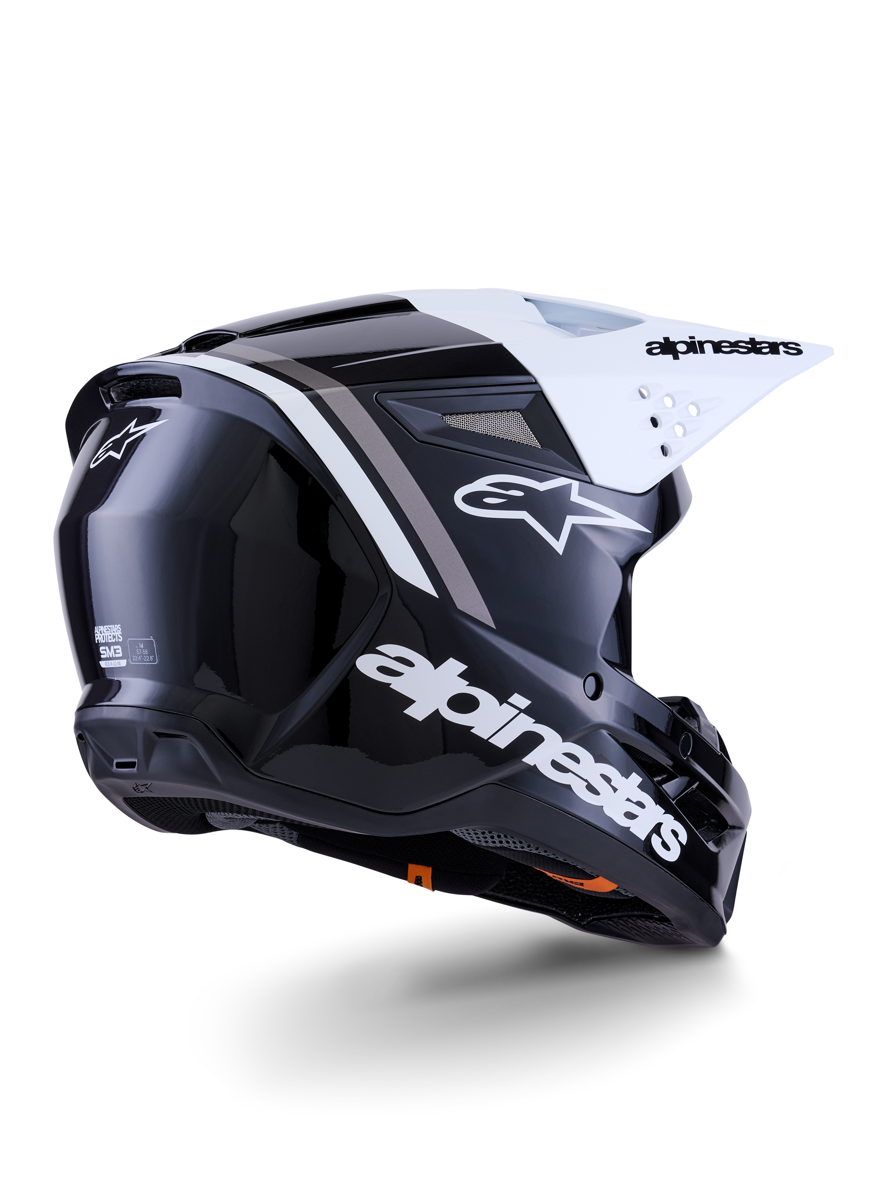 Alpinestars S-M3 Radium Helm, Motocross-Helm, Schwarz, Weiß und Grau glänzend, Rückseitenansicht mit weißem Visier, markantes Alpinestars-Logo an der Seite und hinten, aerodynamische Schale mit Belüftungsgittern, für Offroad-Motocross und Enduro konzipiert