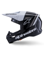 Alpinestars S-M3 Radium Helm ECE 22.06, Motocross-Helm, Seitenansicht, glänzendes schwarz-weißes Finish, graue Rennstreifen, weißes Alpinestars-Logo an der Seite und im Kinnbereich, belüftetes Design für Motocross und Enduro