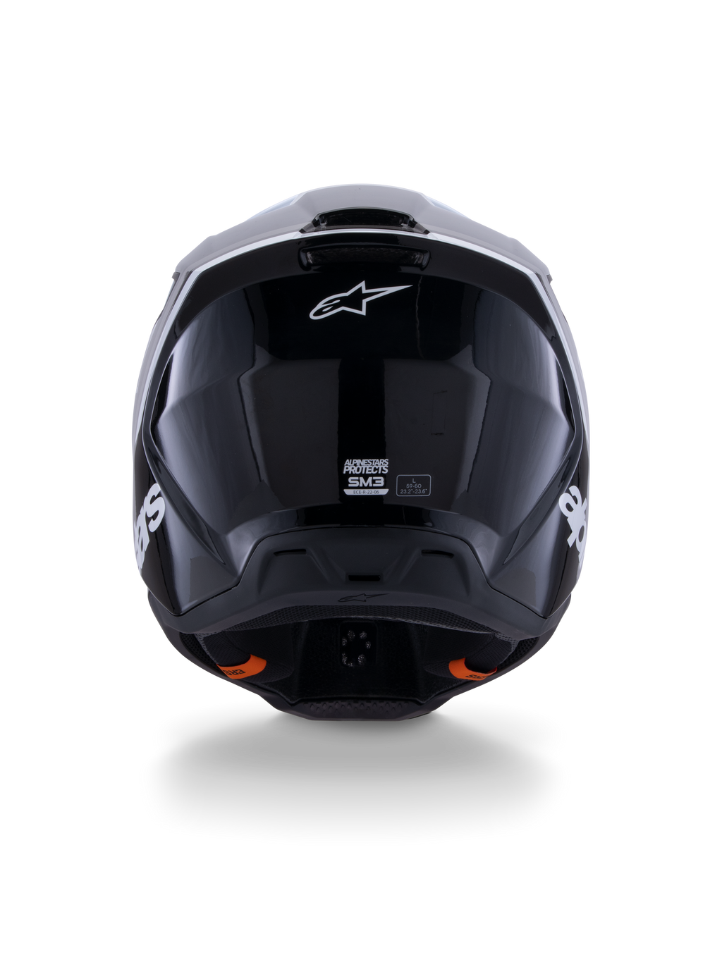 Alpinestars S-M3 Radium Helm ECE 22.06, Motocross-Helm, Schwarz Weiß Grau Glänzend, Rückansicht mit glänzendem schwarzen Finish, Alpinestars Stern-Logo, Belüftungsauslässe und ECE-Zertifizierungsetikett.