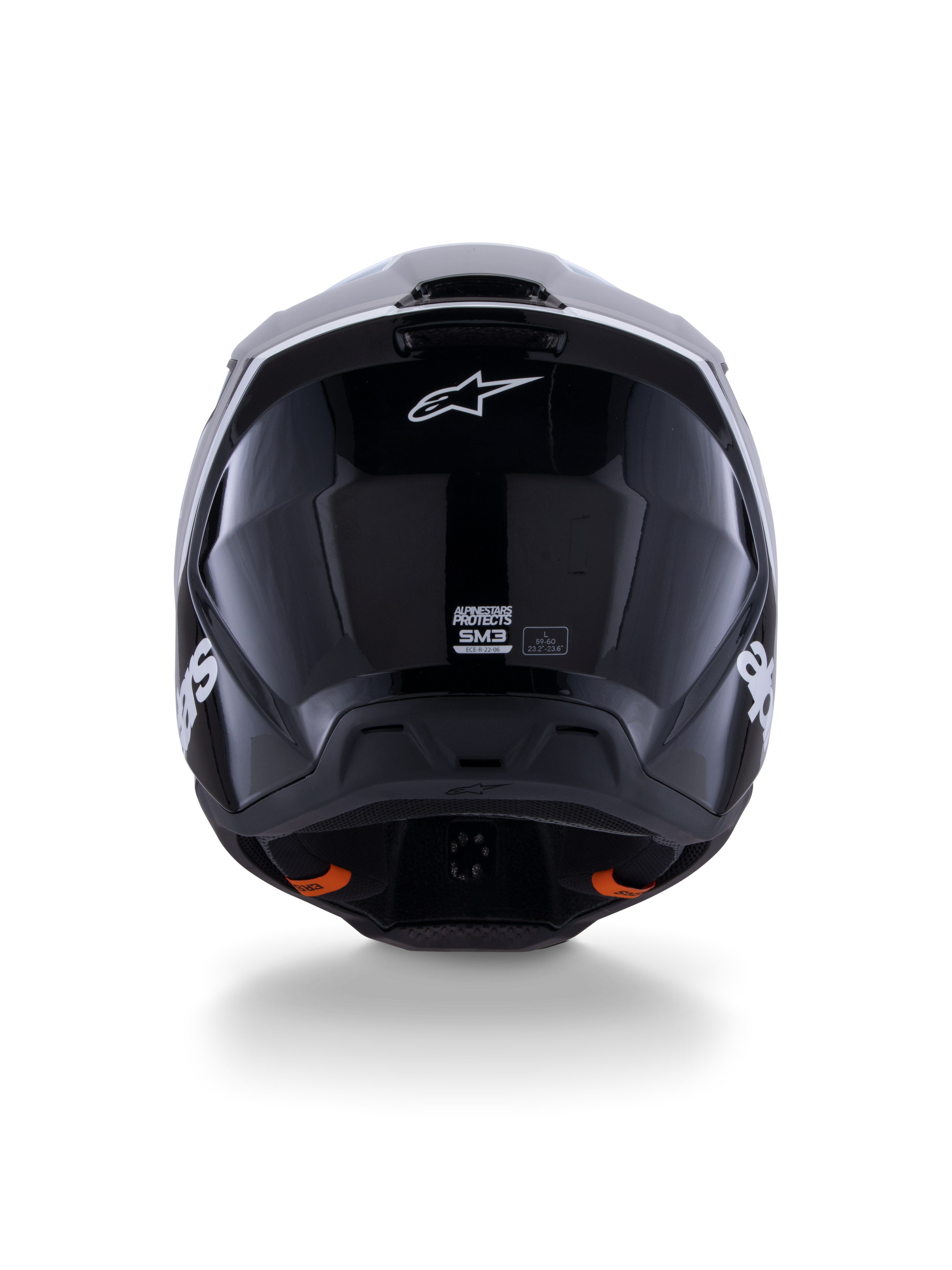 Alpinestars S-M3 Radium Helm ECE 22.06, Motocross-Helm, Schwarz Weiß Grau Glänzend, Rückansicht mit glänzendem schwarzen Finish, Alpinestars Stern-Logo, Belüftungsauslässe und ECE-Zertifizierungsetikett.