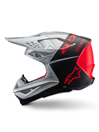 Alpinestars Supertech M10 Flood Helm, Motocross-Helm, Silber und Schwarz mit fluoreszierenden orangefarbenen Akzenten, Seitenprofil, schlankes aerodynamisches Design mit Belüftungsöffnungen, mattes und glänzendes Finish, professioneller Offroad-Rennschutz