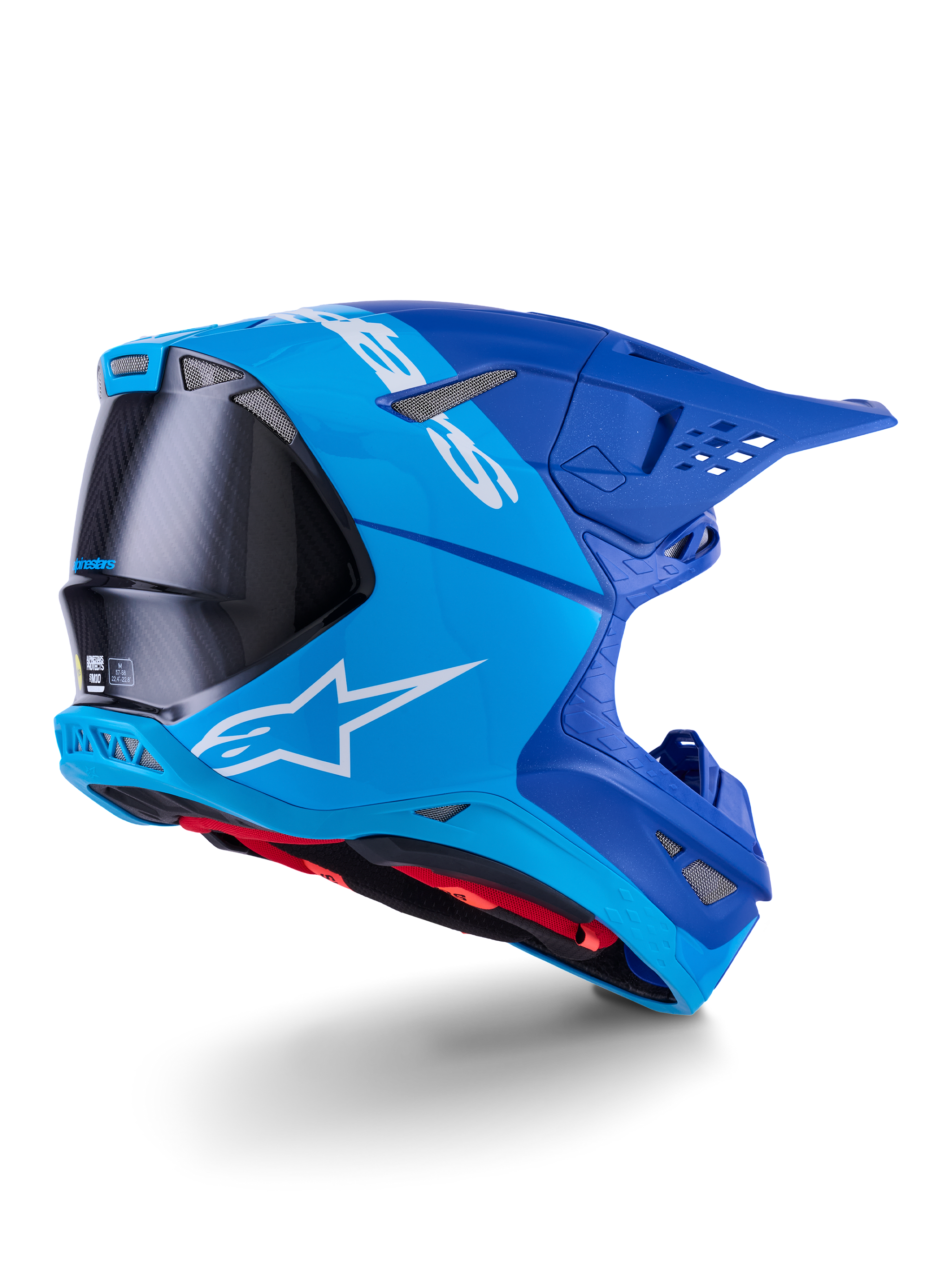 Alpinestars Supertech M10 Flood Helm, Motocross-Helm, Hellblau und Marineblau mit sichtbarer schwarzer Carbonfaser, Rückseiten-Profil mit Belüftungsöffnungen und weißem Logo, rotes Innenfutter, fortschrittliches aerodynamisches Design für Offroad-Performance
