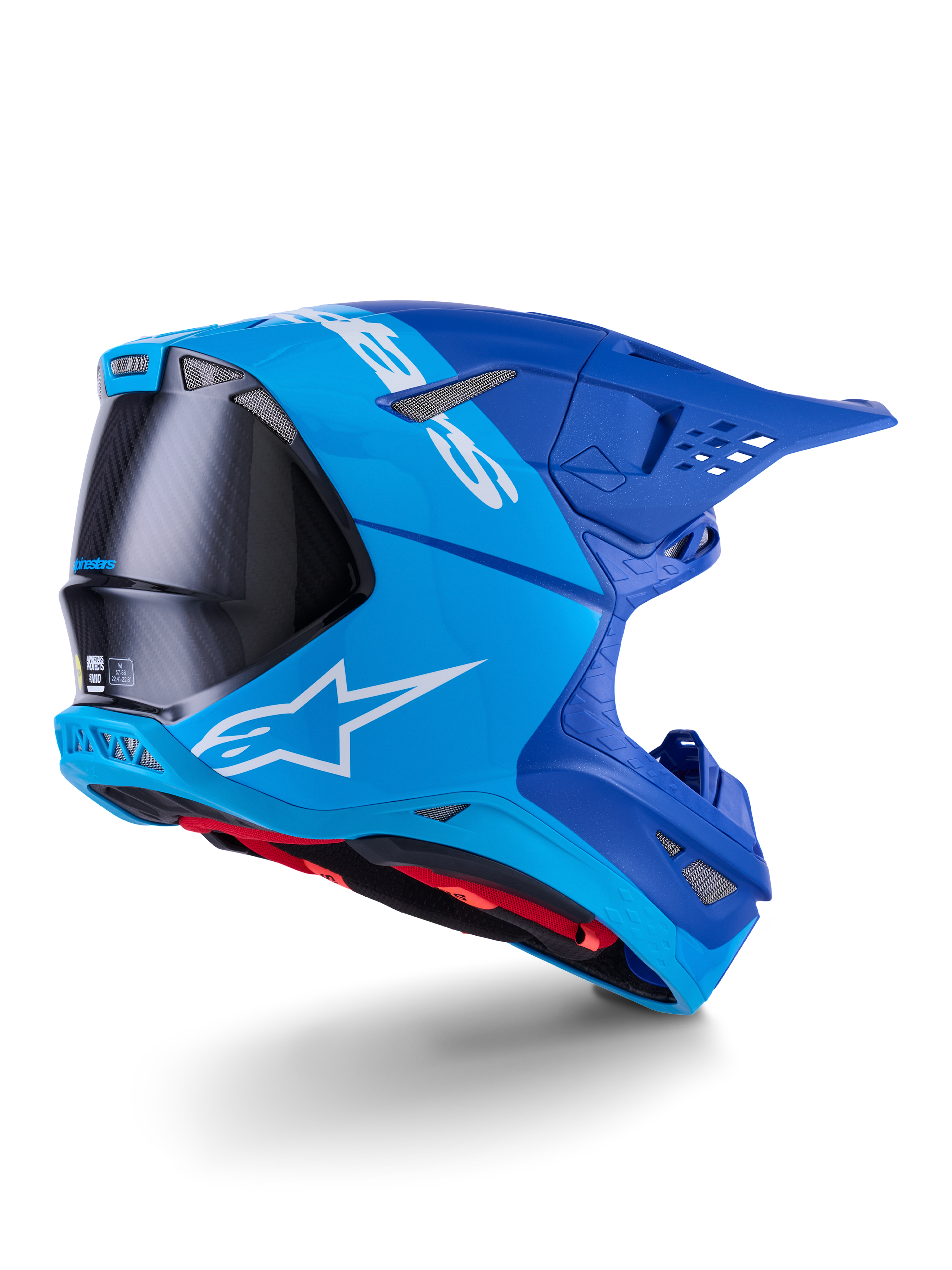 Alpinestars Supertech M10 Flood Helm, Motocross-Helm, Hellblau und Marineblau mit sichtbarer schwarzer Carbonfaser, Rückseiten-Profil mit Belüftungsöffnungen und weißem Logo, rotes Innenfutter, fortschrittliches aerodynamisches Design für Offroad-Performance